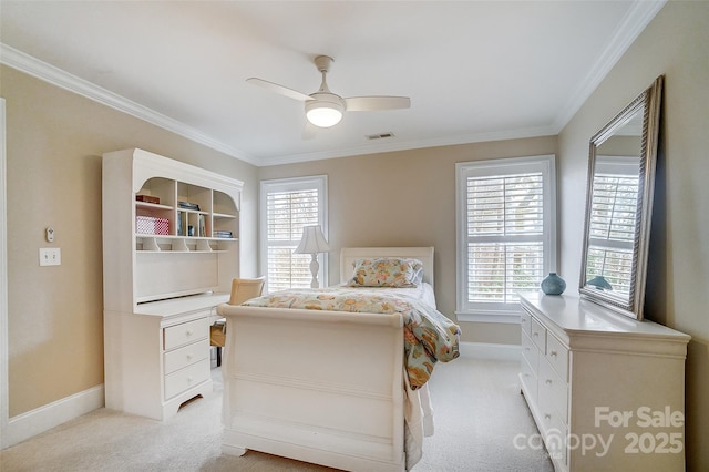 carpeted bedroom featuring ornamental molding and ceiling fan