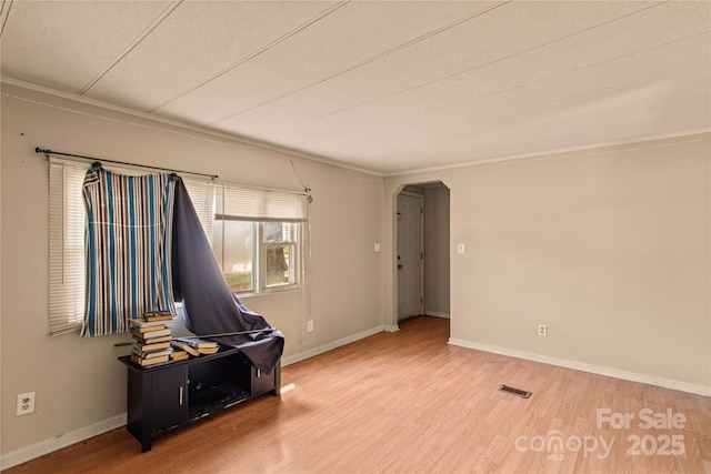 miscellaneous room with hardwood / wood-style floors and a textured ceiling