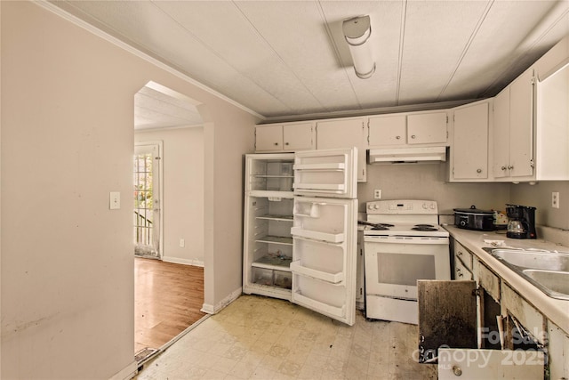 kitchen featuring white range with electric stovetop, white cabinetry, sink, and crown molding