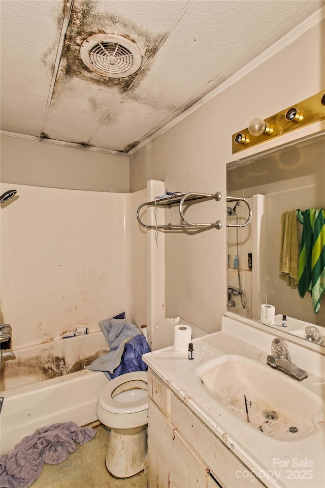 full bathroom with vanity,  shower combination, toilet, and crown molding