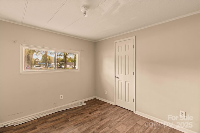 unfurnished room with hardwood / wood-style flooring and ornamental molding