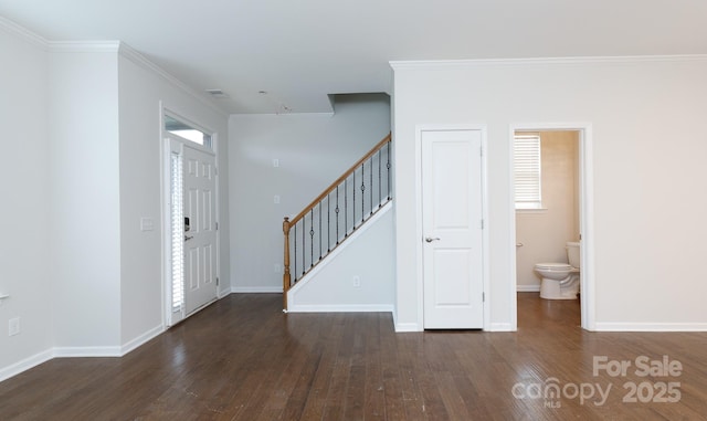 entryway featuring dark hardwood / wood-style floors and crown molding