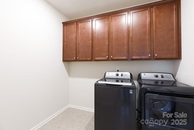 laundry area featuring cabinets and washer and dryer