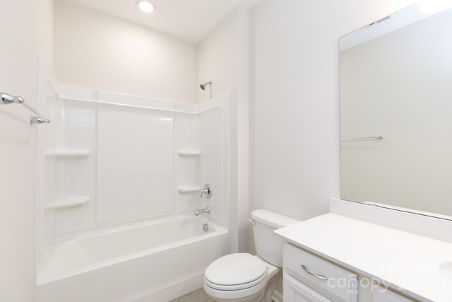 full bathroom featuring toilet, vanity, and  shower combination