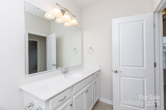 bathroom with tile patterned floors and vanity