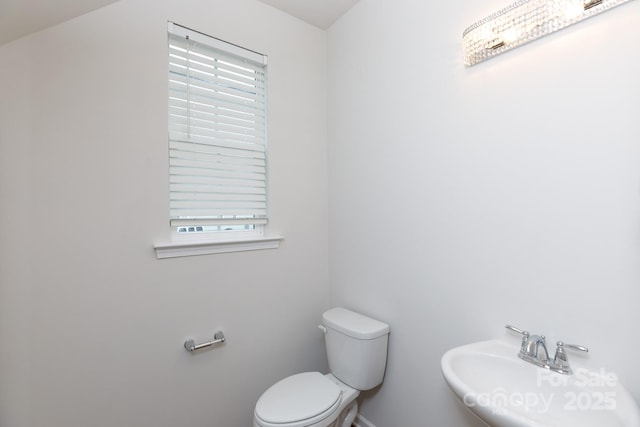 bathroom with toilet and sink