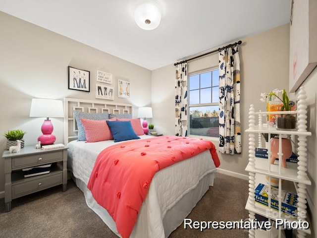 bedroom featuring dark carpet