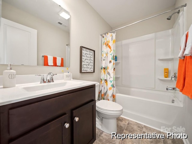 full bathroom featuring vanity, shower / tub combo, and toilet