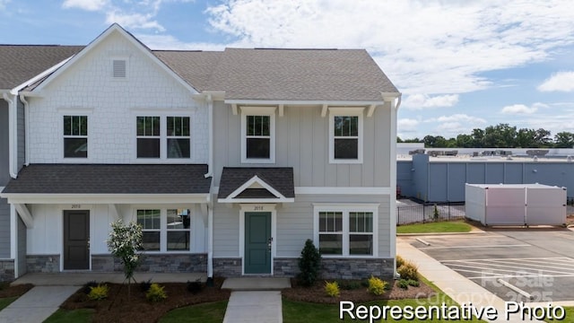 205 Cliffwood St NW Unit Unitb-2, Concord, NC 28027 - view of front facade with stone siding, board and batten siding, roof with shingles, and uncovered parking
