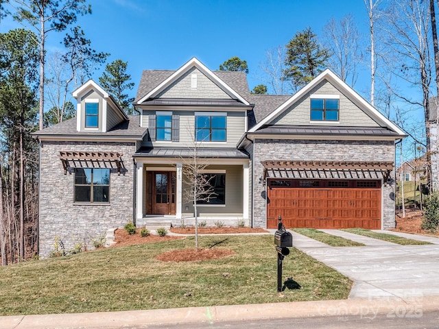 craftsman-style home with concrete driveway, metal roof, an attached garage, a standing seam roof, and a front lawn