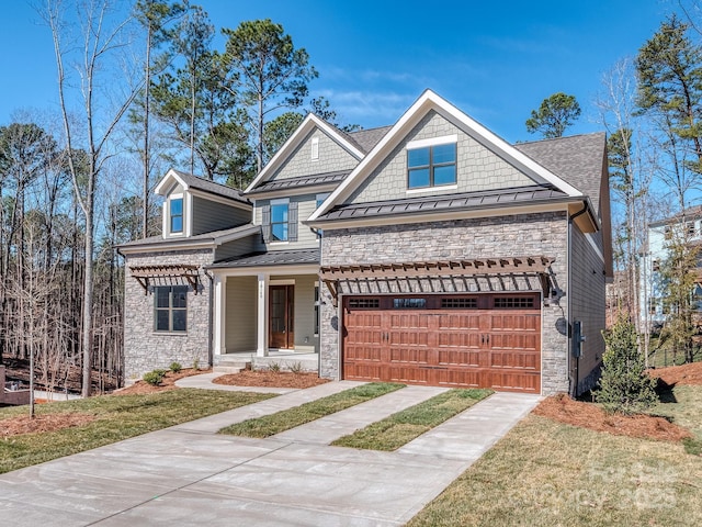 view of front of home with a garage, a standing seam roof, metal roof, and concrete driveway