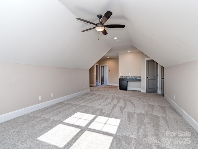 bonus room with recessed lighting, a ceiling fan, light carpet, vaulted ceiling, and baseboards