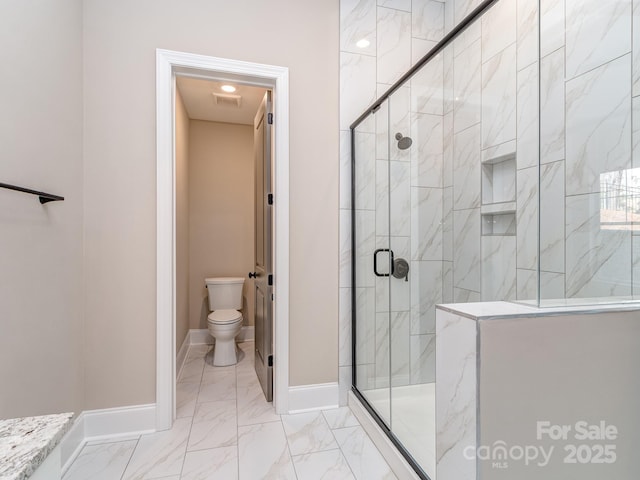 full bathroom featuring marble finish floor, baseboards, a shower stall, and toilet