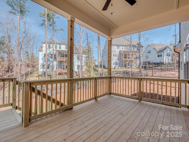 wooden deck featuring a ceiling fan