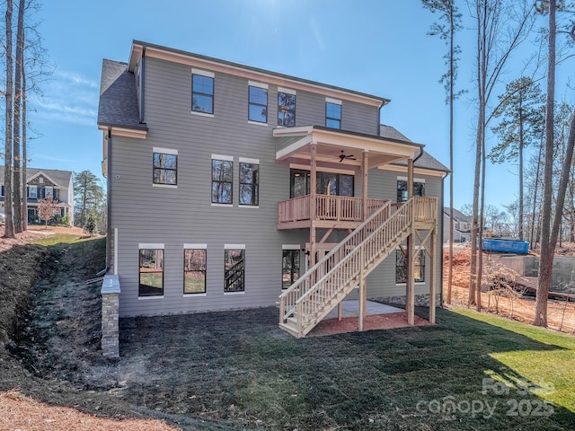 back of house featuring roof with shingles, a yard, a patio, stairway, and a ceiling fan