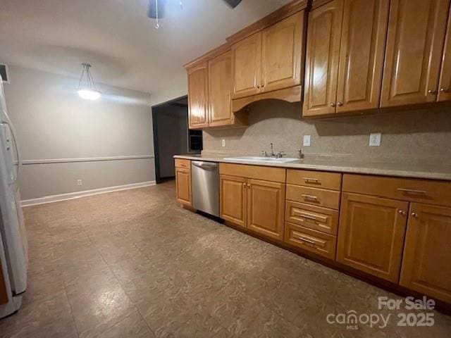 kitchen featuring sink, refrigerator, dishwasher, pendant lighting, and ceiling fan