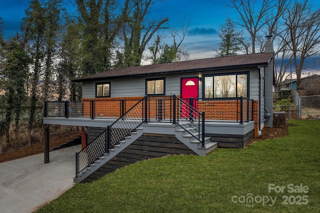 453 Riverview Dr, Asheville, NC 28806 - view of front of house with a yard and central AC unit