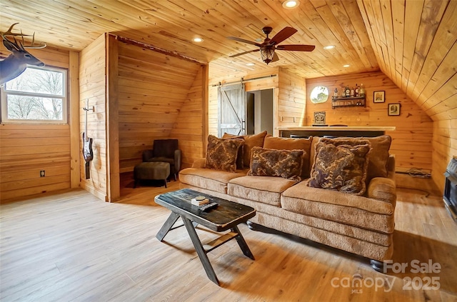 living room with wooden ceiling, wooden walls, wood finished floors, and vaulted ceiling