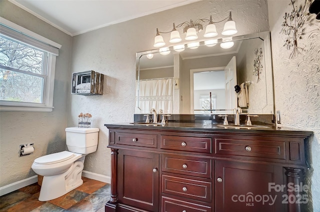 full bathroom featuring ornamental molding, a textured wall, and a sink