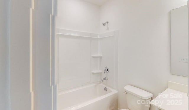 full bathroom featuring toilet, vanity, and bathing tub / shower combination