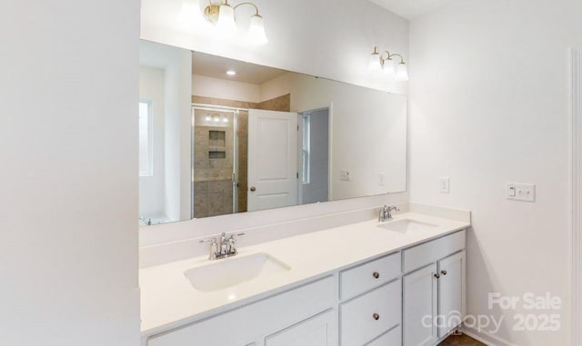 bathroom with a shower with door and vanity