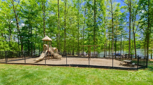 view of jungle gym with a water view and a yard