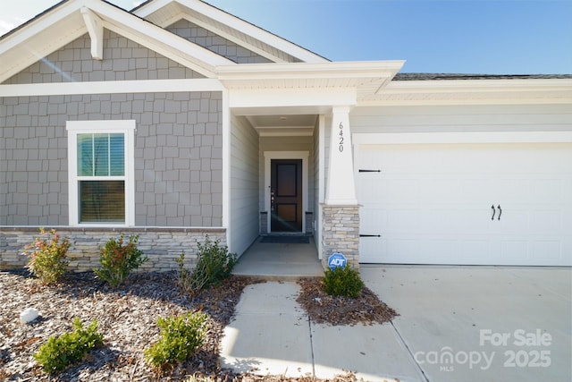 entrance to property featuring a garage