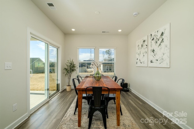 dining space featuring hardwood / wood-style floors