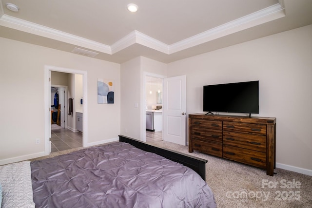 bedroom featuring carpet, crown molding, and ensuite bath