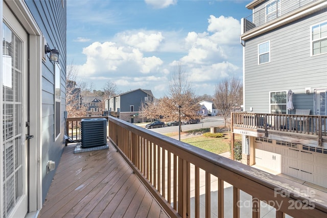 wooden terrace featuring cooling unit