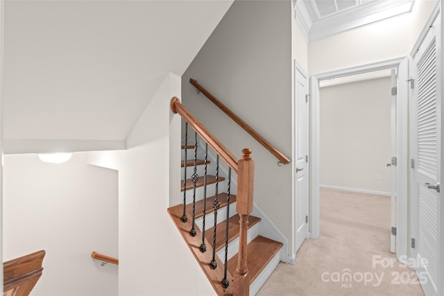 stairs featuring ornamental molding, vaulted ceiling, and carpet