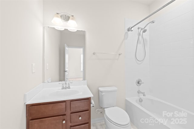 full bathroom featuring toilet, tiled shower / bath combo, tile patterned flooring, and vanity