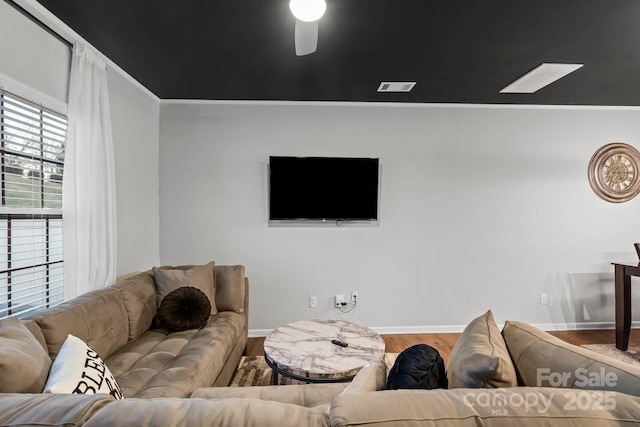 living room with ceiling fan and hardwood / wood-style floors