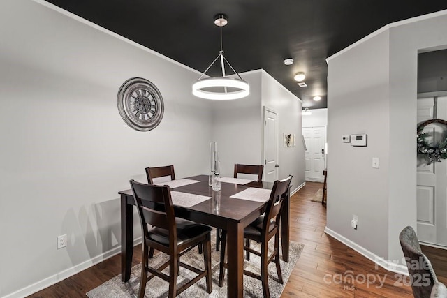 dining area with wood-type flooring