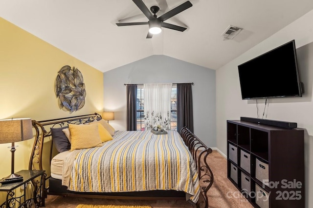 bedroom with vaulted ceiling, ceiling fan, and carpet flooring