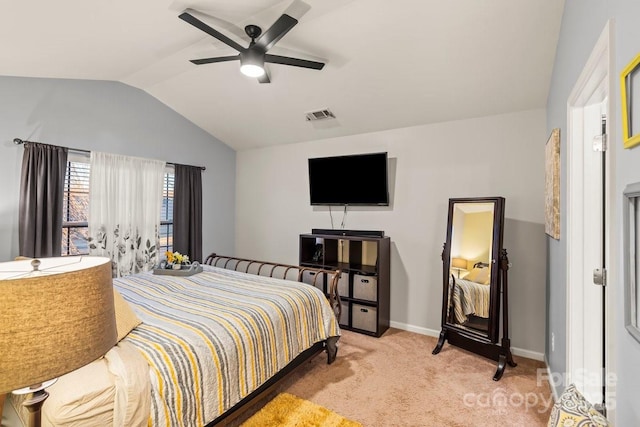 carpeted bedroom with ceiling fan and lofted ceiling