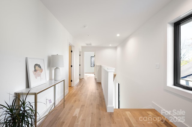 hallway featuring light hardwood / wood-style floors