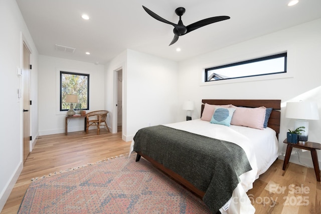 bedroom with ceiling fan and light wood-type flooring