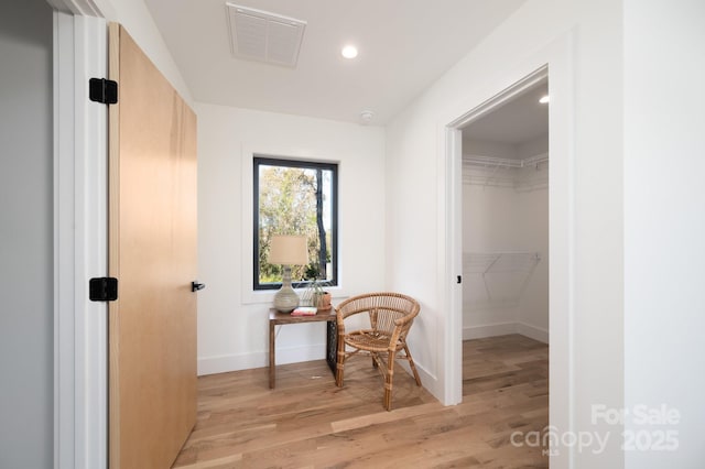 hallway featuring light hardwood / wood-style flooring