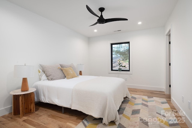 bedroom featuring ceiling fan and light hardwood / wood-style floors