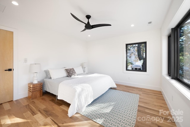 bedroom featuring ceiling fan and light hardwood / wood-style floors