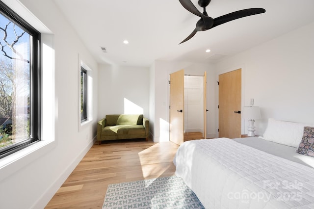 bedroom featuring ceiling fan and light hardwood / wood-style flooring