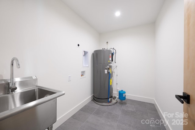 clothes washing area featuring sink, hookup for a washing machine, water heater, and electric dryer hookup