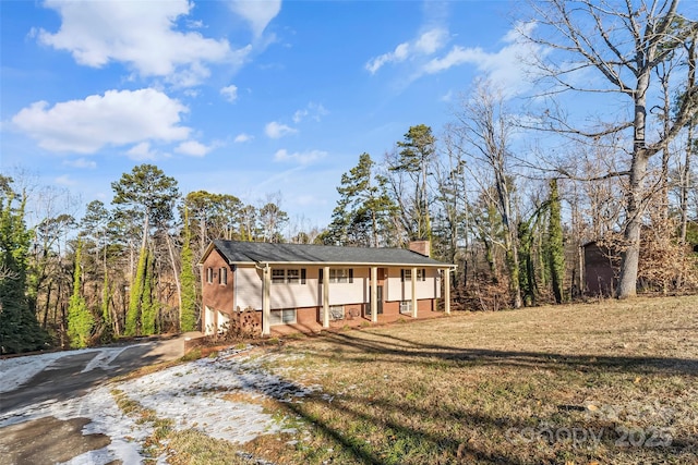 view of front of house with a front lawn and a porch