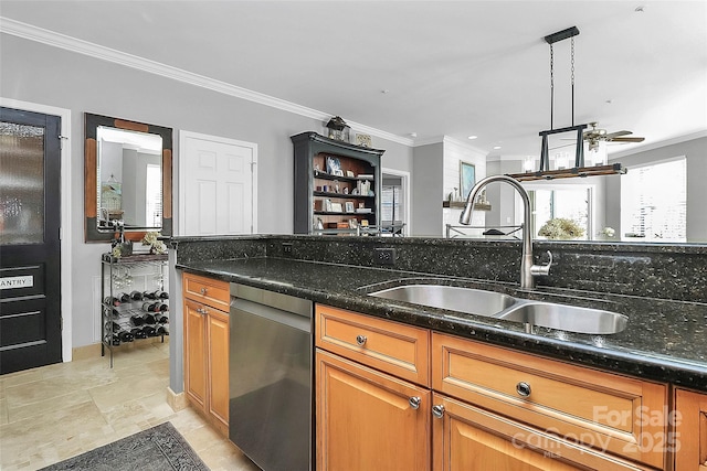 kitchen featuring dishwasher, hanging light fixtures, dark stone counters, ornamental molding, and sink