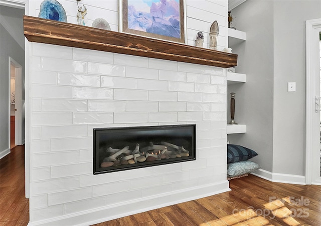 interior details with crown molding and hardwood / wood-style floors