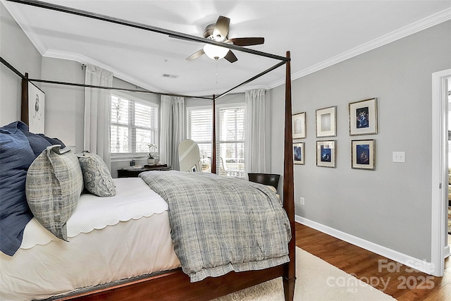 bedroom with wood-type flooring, ceiling fan, and ornamental molding