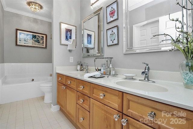 bathroom featuring toilet, tile patterned floors, a tub, vanity, and crown molding