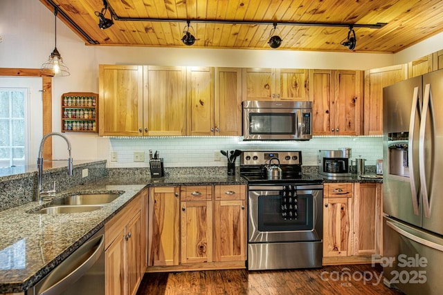 kitchen with sink, wood ceiling, appliances with stainless steel finishes, hanging light fixtures, and dark stone counters