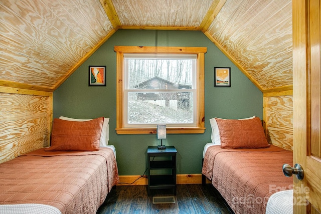 bedroom with vaulted ceiling, wooden ceiling, and dark hardwood / wood-style flooring